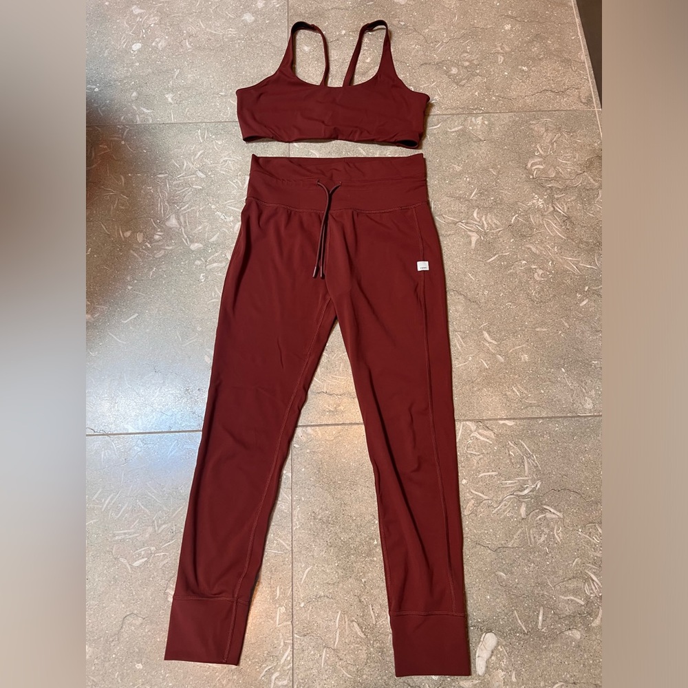 Vuori daily leggings and sports bra set.  Deep purple/burgundy color.